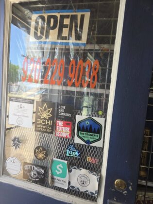 ocean breeze cbd door signage 315x420